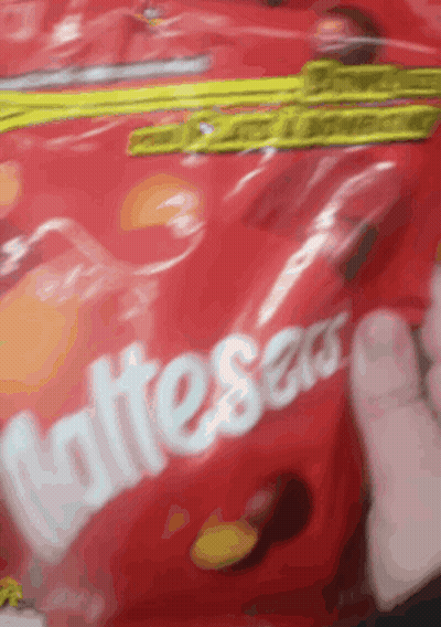 Someone Holding Bag Of Skittles Candy GIF