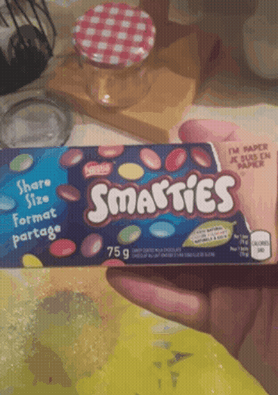 Someone Holding Box Of Smarties Candy GIF