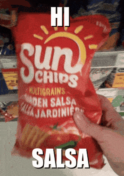 Someone Is Holding A Bag Of Sun Chips In Salsa GIF