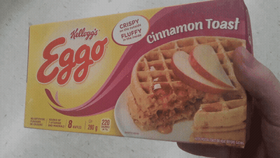 Someone Is Holding A Box Of Kellogg 'S Eggo Cinnamon Toast GIF