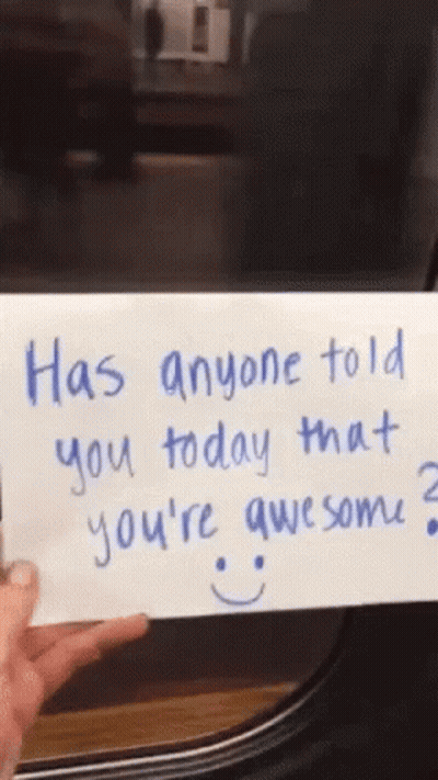 Someone Is Holding A Piece Of Paper That Says Has Anyone Told You Today That You 'Re Awesome GIF