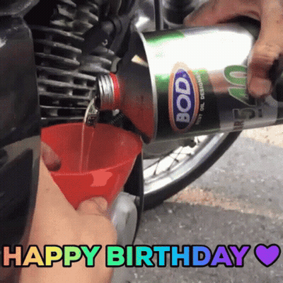 Someone Is Pouring Bode Oil Into A Motorcycle GIF