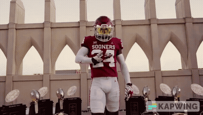 Sooners Football Player with Trophies
