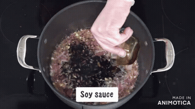 Soy Sauce Is Being Added To A Pot Of Food GIF