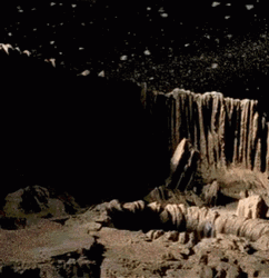 Space Big Worm Peeking From Hole GIF