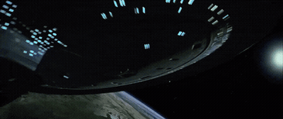 Spaceship Flying Over Earth GIF