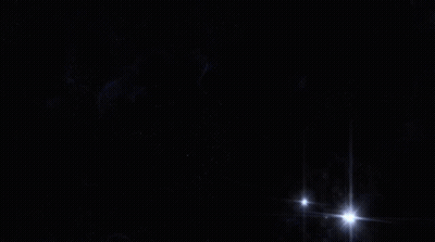 Spaceships Flying Over Planet GIF