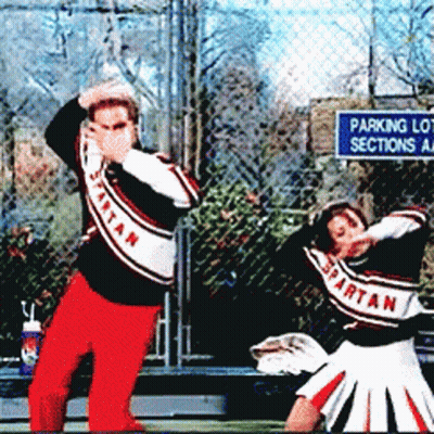 Spartan Cheerleaders Dancing In Front Of A Parking Lot Sections Sign GIF