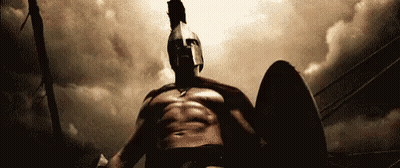 Spartan Man Holding Shield And Sword GIF