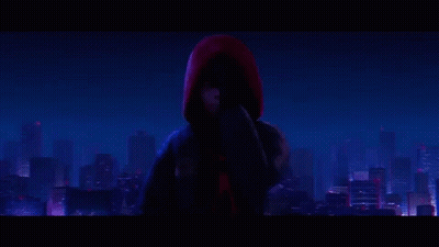Spider-Man Is Standing In Front Of A City At Night . GIF