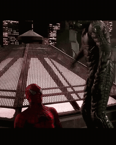 Spiderman Costume Man Next To Black Suit Man GIF