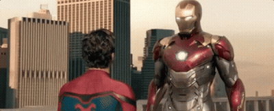 Spiderman Costume Standing Next To Iron Man Suit GIF