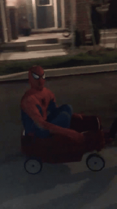 Spiderman Lying On Sidewalk GIF
