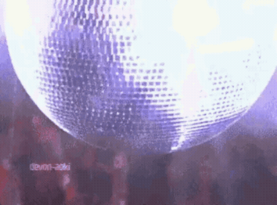 Spinning Disco Ball In Dark Room GIF