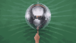 Spinning Disco On Ball Finger GIF