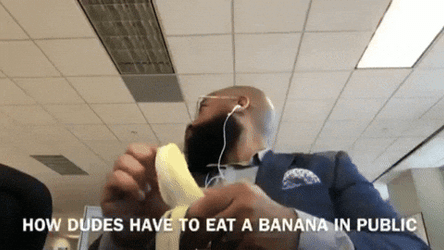 Spinning Office Guy Peeling Banana GIF