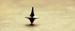 Spinning Totem On The Floor In Inception GIF