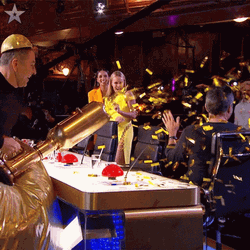 Splashing The Confetti Cannon To Simon Cowell GIF