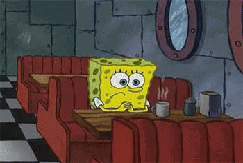 Spongebob Is Sitting At A Table In A Diner With A Cup Of Coffee GIF