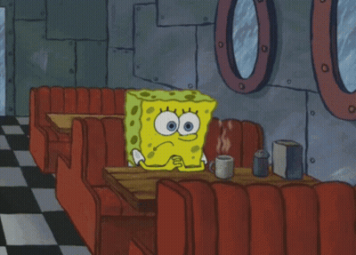 Spongebob Sits At A Table In A Diner With A Cup Of Coffee GIF