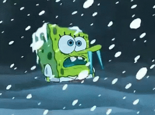Spongebob Squarepants Is Covered In Ice And Snow While Holding An Icicle In His Mouth . GIF
