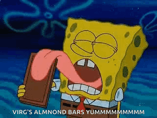Spongebob Squarepants Is Holding A Chocolate Bar With His Tongue Out . GIF