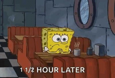 Spongebob Squarepants Is Sitting At A Diner Table With A Cup Of Coffee . GIF