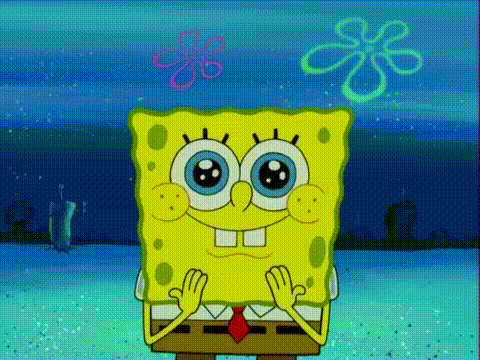 Spongebob Squarepants Is Sitting On A Table With His Hands Folded In Front Of Him . GIF