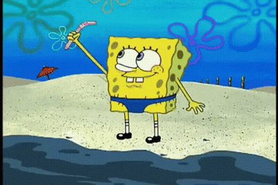 Spongebob Squarepants Is Standing On The Beach Holding A Worm In His Hand . GIF