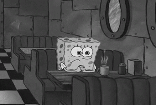 SpongeBob SquarePants Sitting At Diner Table Holding Coffee GIF