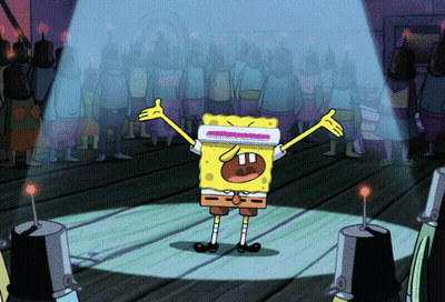 SpongeBob Standing With Arms Outstretched Before Crowd GIF