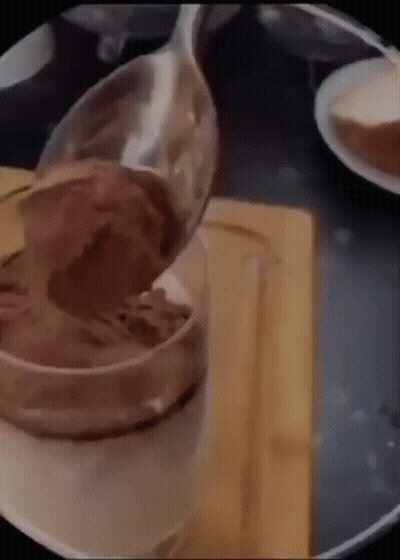 Spoon Pouring Chocolate Mousse Into Cup GIF
