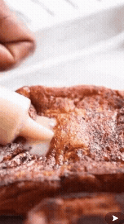 Spreading Icing On French Toast With Powdered Sugar GIF