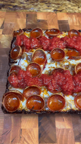 Square Pizza With Pepperoni And Tomato Sauce GIF