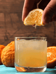 Squeezing Orange On Margarita GIF