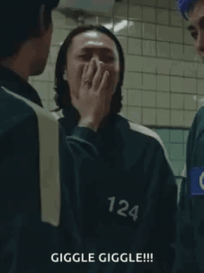 Squid Game Man Covering Mouth Laughing GIF