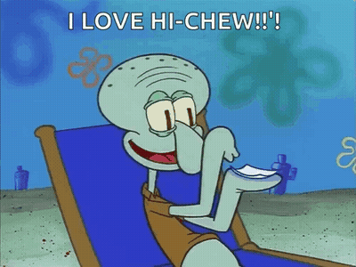 Squidward Eating Paper On Beach GIF