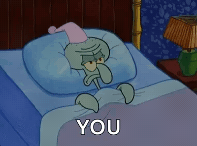 Squidward From Spongebob Squarepants Is Laying In A Bed With A Pillow And A Nightcap On . GIF