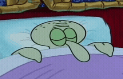 Squidward From Spongebob Squarepants Is Laying In Bed GIF