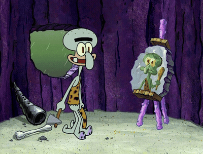 Squidward From Spongebob Squarepants Is Looking At His Reflection In A Mirror GIF