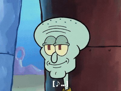 Squidward From Spongebob Squarepants Is Smiling And Looking At The Camera While Standing Next To A Wall . GIF