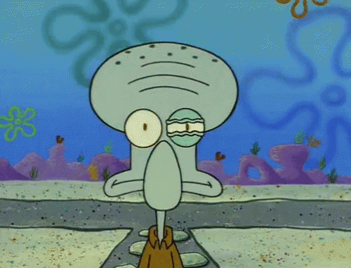 Squidward From Spongebob Squarepants Is Standing On A Rock In The Sand GIF