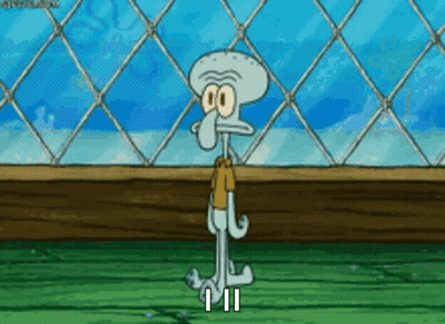 Squidward Standing In Front Of Chain Link Fence GIF