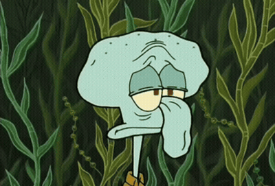 Squidward Surrounded By Seaweed And Plants GIF