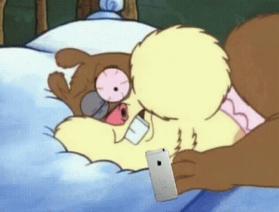 Squirrel In Bed With Phone In Mouth GIF