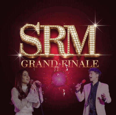 SRM Grand Finale Man And Woman Singing Into Microphones GIF