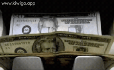 Stack Of 20 Dollar Bills On Keyboard GIF