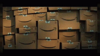 Stack Of Amazon Boxes With Smiley Faces GIF