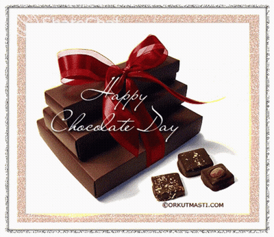 Stack Of Chocolate Boxes With Red Bow GIF