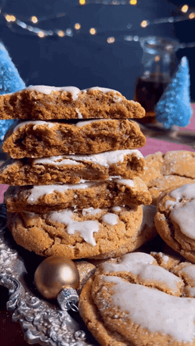 Stack Of Cookies With One Missing A Bite GIF